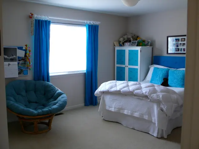 As we can see in a picture that, this is a room, bed, chair, window, curtain, cupboard, photo frame...